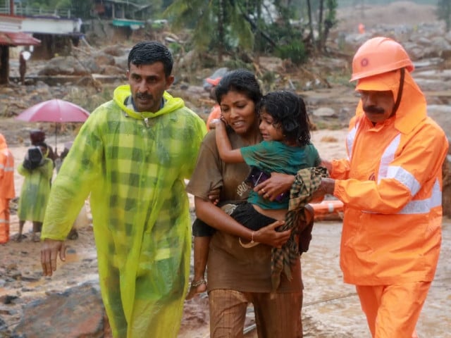 rescuers help residents to move to a safer place at a landslide site after multiple landslides in the hills in wayanad in the southern state of kerala india july 30 2024 photo reuters